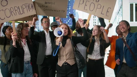 People protesting together during a strike and public march against corruption Stock Footage 326264981