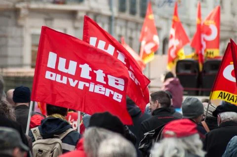 People from public service protesting with flags against the lower wages Stock Photos