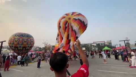People pulling the hot air balloon rope for preparing for flight Stock Footage 253884746
