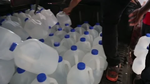 People pulling out from the back of a truck water jugs 2016 Ecuador quake (1) Stock Footage 62832535