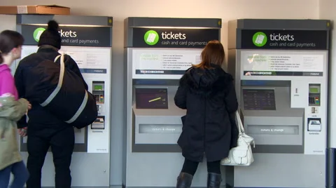 People Purchasing Train Tickets from a Machine Stock Footage 61642169