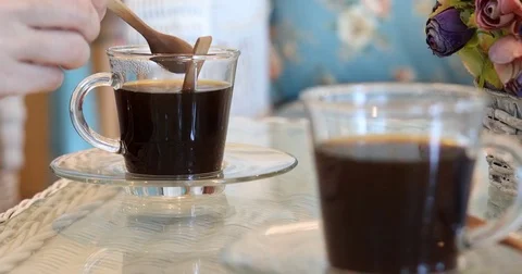 People put a sugar in hot coffee drink, cafe restaurant scene Stock Footage 80484737