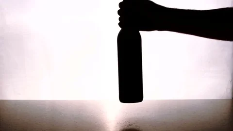 People put on table bottle of wine and two glasses indoor. Stock Footage 82237180