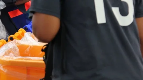 People Putting Garbage In to Trash Video stock 76971500