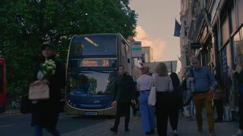 People que for buses during evening in old Oxford, England Stock Footage 230354241
