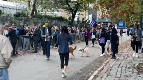 People que in long lines for the 50th running of the New York City Marathon Stock Footage 166328833