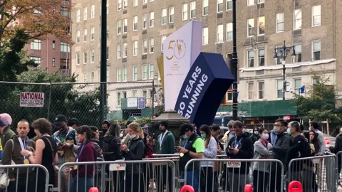 People que in long lines for the 50th running of the New York City Marathon Stock Footage 166329213