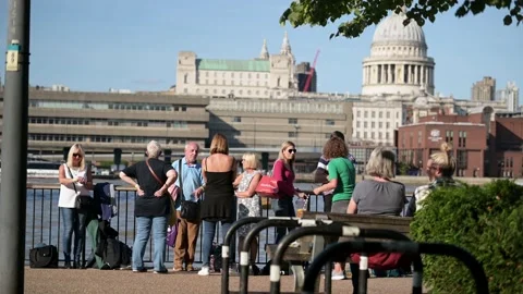 People queue along Thames riverbank to see the Queen lying in state Stock Footage 215952072