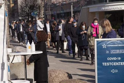 People queue and wait in line for a Coronavirus Covid-19 test at the pop-up Stock Photos