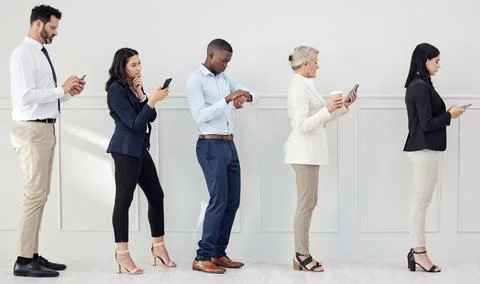 People, queue and waiting in line for job interview, recruitment or reading cv Stock Photos