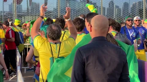 People in the queue are fan of brazil football team in world cup qatar Stock Footage 228597555