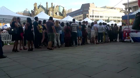 People  queue in birmingham victoria square Video stock 52082515