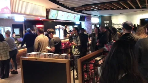 People queue for the cinema Stock Footage 199440123
