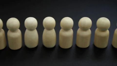 People queue concept. Long line of wooden figures of people Stock Footage 154991560