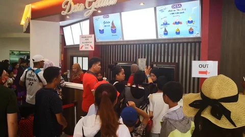 People queue on counter Stock Footage 114343578