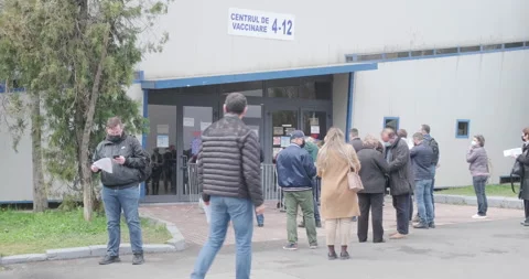 People queue for Covid-19 coronavirus vaccine, in Bucharest, Romania. Stock Footage 153088266