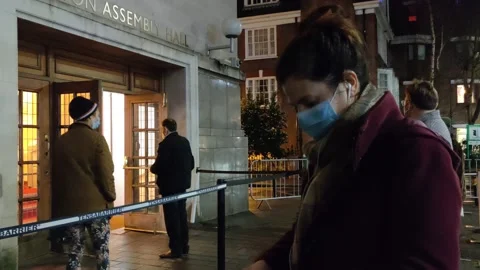 PEOPLE QUEUE FOR COVID-19 TESTING AT SAME DAY SITE LONDON UK 4K Stock Footage 145420290