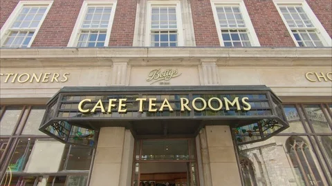 People queue to enter Bettys Tea Rooms, York, Yorkshire, England Stock Footage 119366903