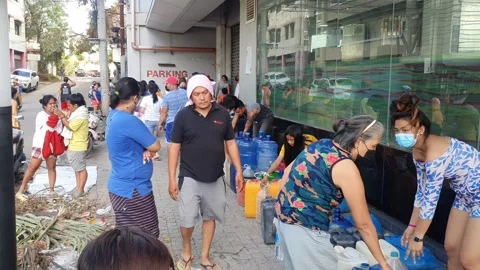 People queue for fresh water after Typhoon Odette,Cebu,Philippines Stock Footage 168371221