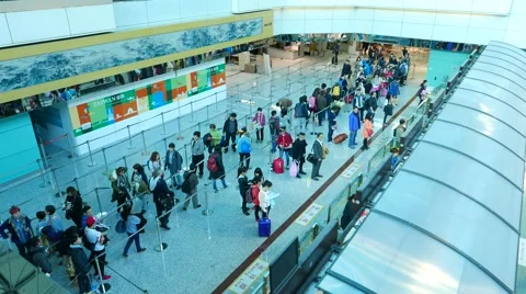 People queue in front of passport control counters international departure Stock Footage 49827286