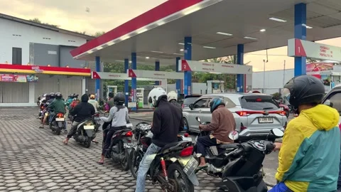 People queue at a fuel station in Indonesia. Stock Footage 337743385