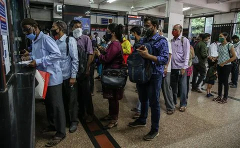 People queue up to get the monthly pass for local train in Mumbai, India - 11 Au Stock Photos