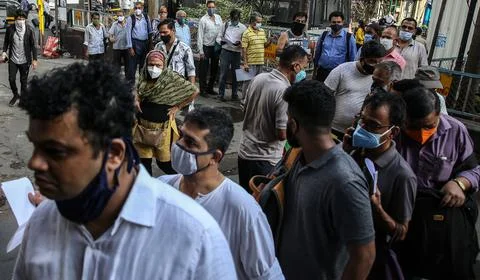 People queue up to get the monthly pass for local train in Mumbai, India - 11 Au Stock Photos
