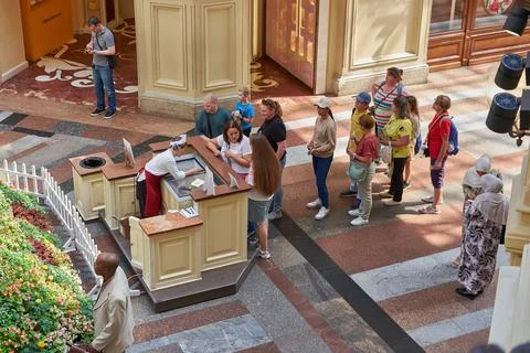 People queue for ice cream inside the GUM department store Stock Photos