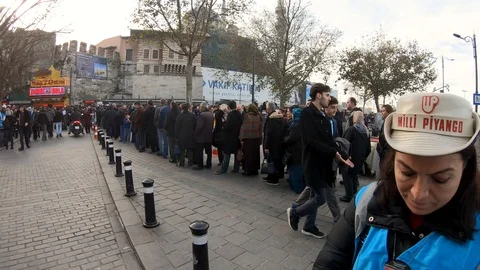 People queue infront of Nimet abla, national lottery store, istanbul, Turkey Stock Footage 99931871