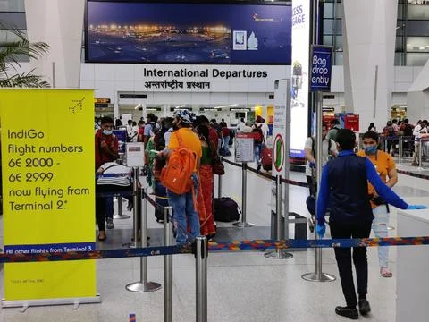 People queue lining up at check in counter in IGI Airport Stock Photos