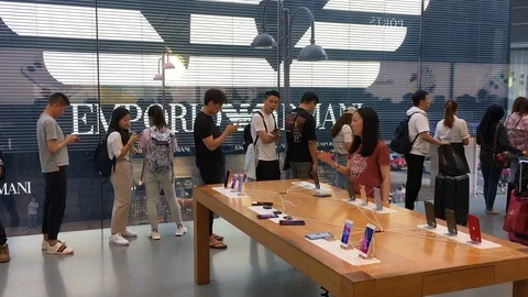 People queue up for new iPhones in Hong Kong Stock Footage 116874192