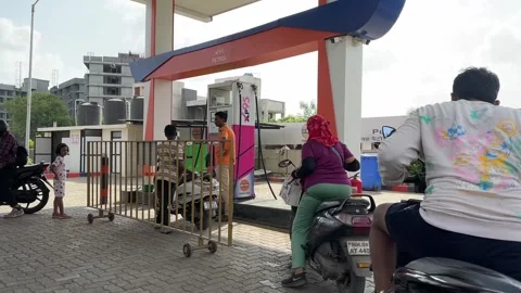 People Queue at Petrol Pump in India During Daytime 4K Video Stock Footage 336377209