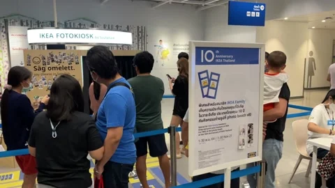 People queue at photo booth at the 10th anniversary  of IKEA Thailand Stock Footage 171595519