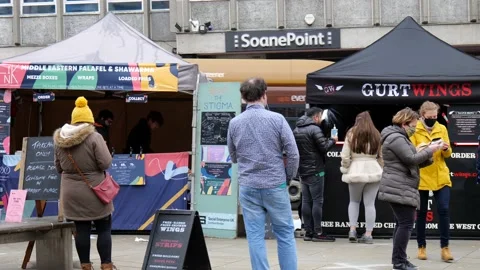 People queue to purchase lunch a street food market in Reading, Berkshire, UK Video stock 150023854