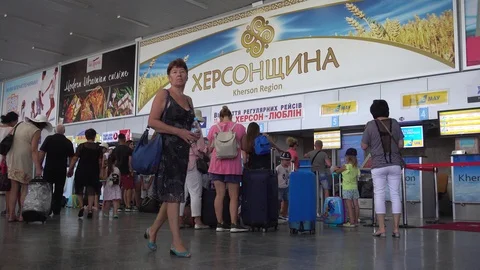 People queue at the registration desk for luggage check-in Stock Footage 94127103