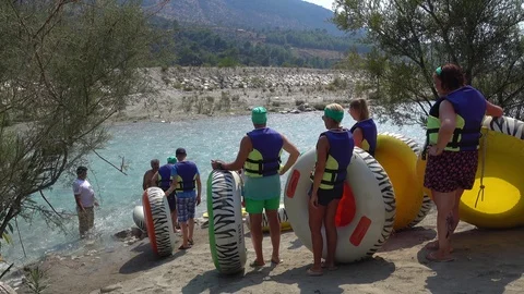 People in a queue for Ringo rafting along the Saklikent river Stock Footage 94193651
