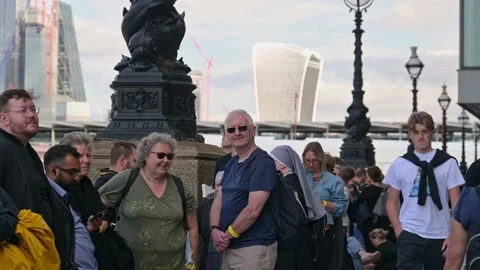 People in The Queue to see the Queen laying in state Stock Footage 211835254