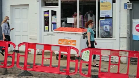 People queue with social distancing outside shop. Stock Footage 236664685