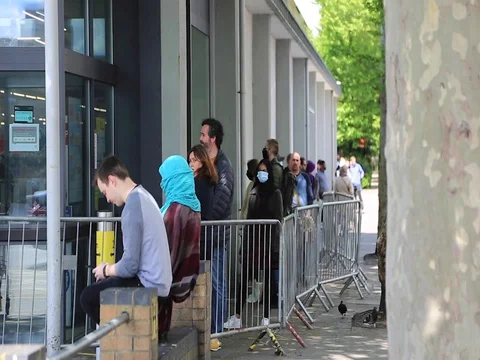 People queue for supermarket during corona virus lock down, London. Stock Footage 129565247