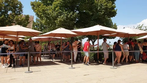 People queue for tickets in Alhambra, Granada, Spain. Static shot Stock Footage 121068381