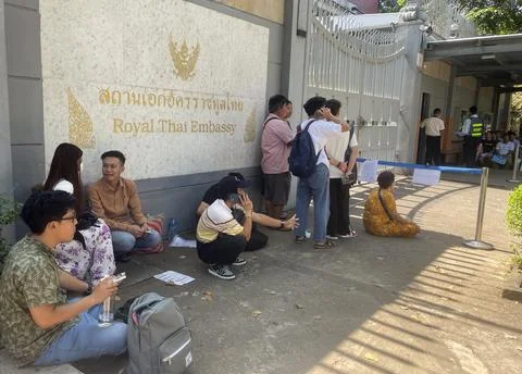 People queue for visas at the Thai embassy in Yangon after military activates co Stock Photos