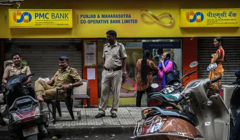 People queue to withdraw their funds from PMC bank in Mumbai, India - 24 Sep 201 Stock Photos