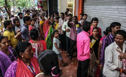People queue to withdraw their funds from PMC bank in Mumbai, India - 24 Sep 201 Stock Photos