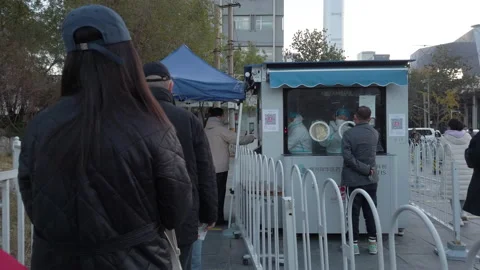 People queueing for covid test on street, Beijing, China. Stock Footage 225669749
