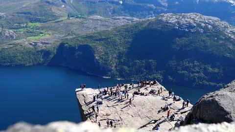People queueing for photos on corner spot on top of famous Pulpit Rock. 動画素材 283845853