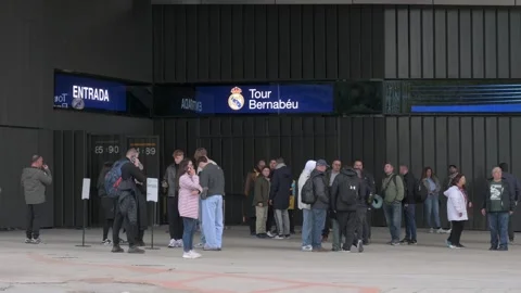 People queueing at the Santiago Bernabeu stadium entrance in Madrid Stock Footage 328578963