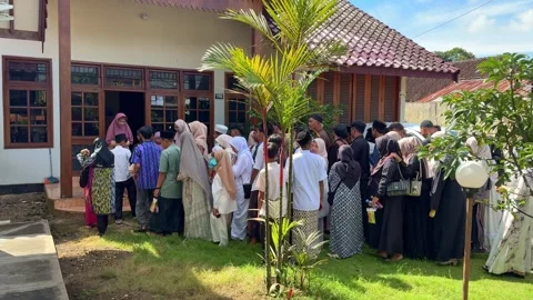 People queueing to shake hands and seek forgiveness on Eid al-Fitr, Stock Footage 332939293