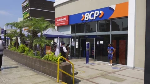 People queuing at a BCP and SCOTIABANK banks with masks and face shields Stock Footage 149897477