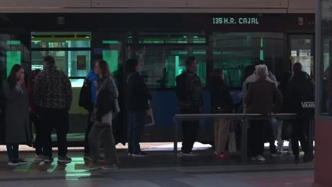 People queuing to board bus in Madrid Video stock 329592850