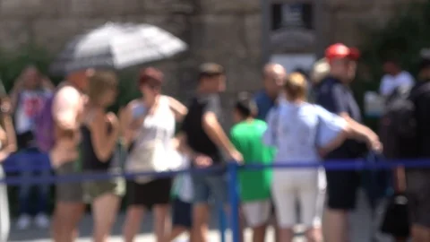 People queuing to enter a guided natural park. Blurred Image People. Stock Footage 114065332